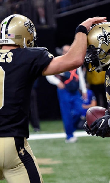 Pumped-up Payton coaches Saints to 49-21 rout of Rams